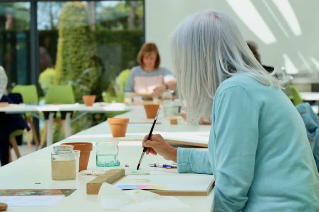 women painting in a watercolour workshop