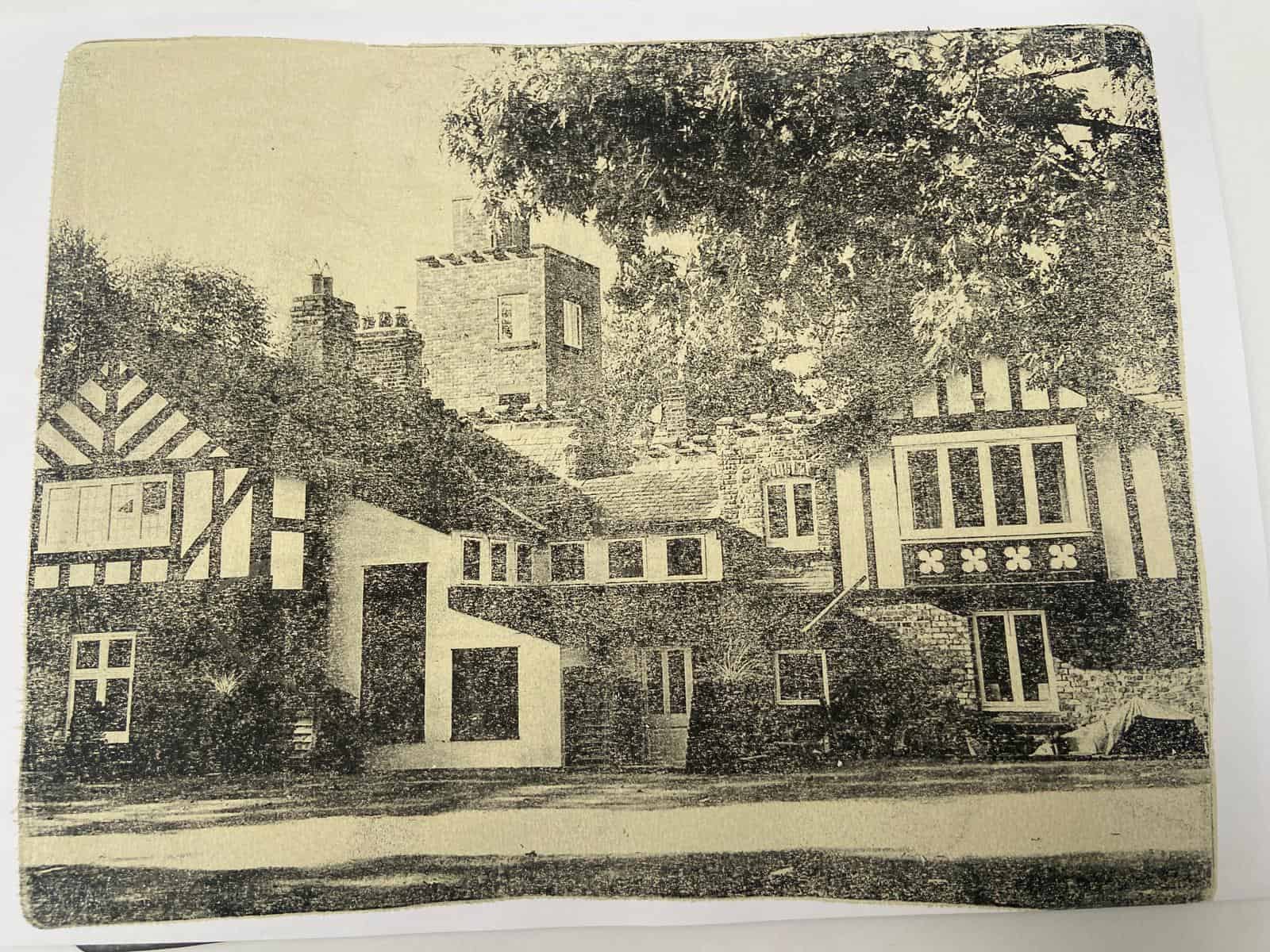 Old black and white picture of a charming house
