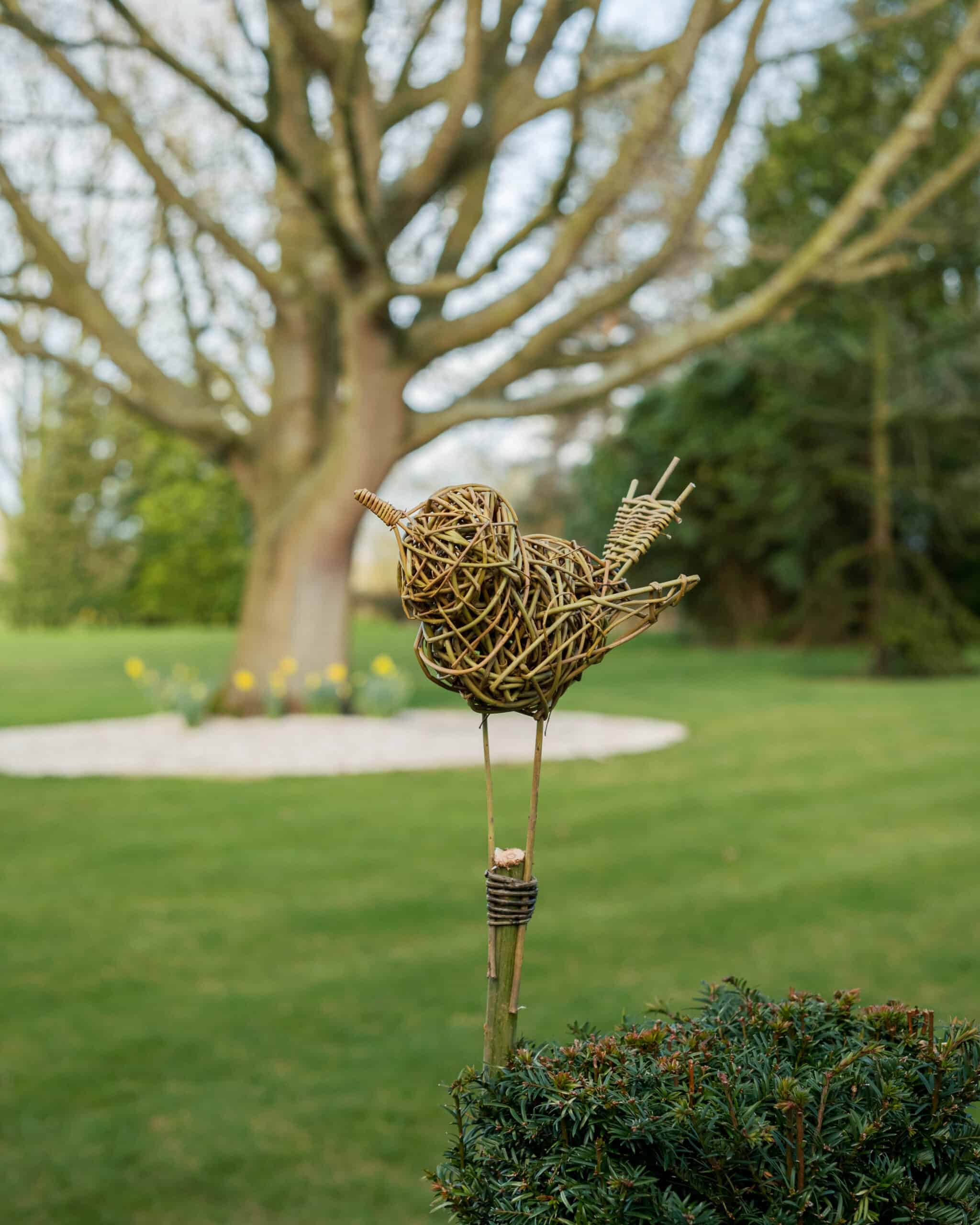 Willow bird sculpture on a stick